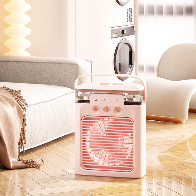 Pink portable fan on a wooden floor with a blurred background