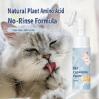 Cat licking its paw next to a bottle of pet cleaning foam with text in Chinese.